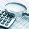 Magnifying glass on financial chart Magnifying glass on financial chart